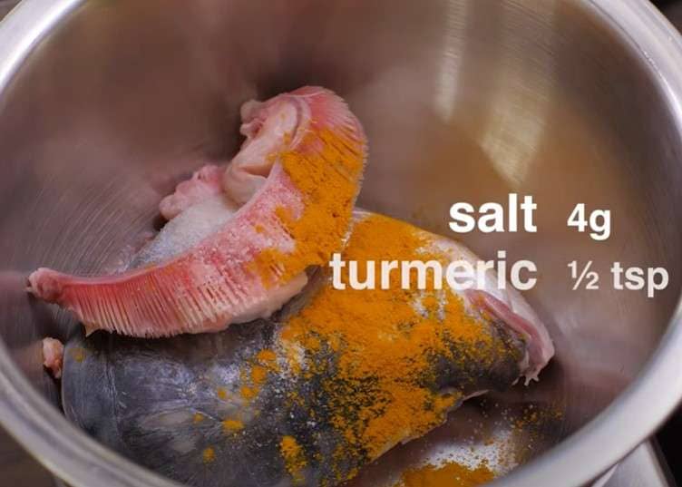 Marinate the fish head with salt and turmeric